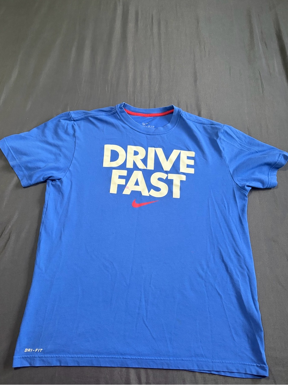 Nike Dri-Fit blue t-shirt with white text and red Nike swoosh. Size L.